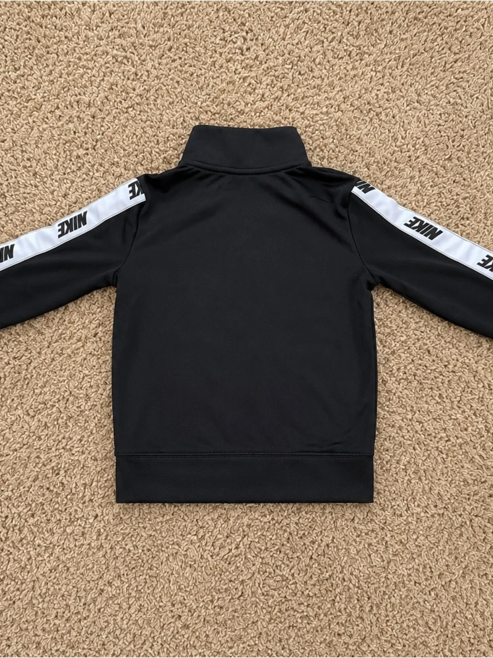 Nike Black Kids Zip-Up Track Jacket with White Logo Stripe